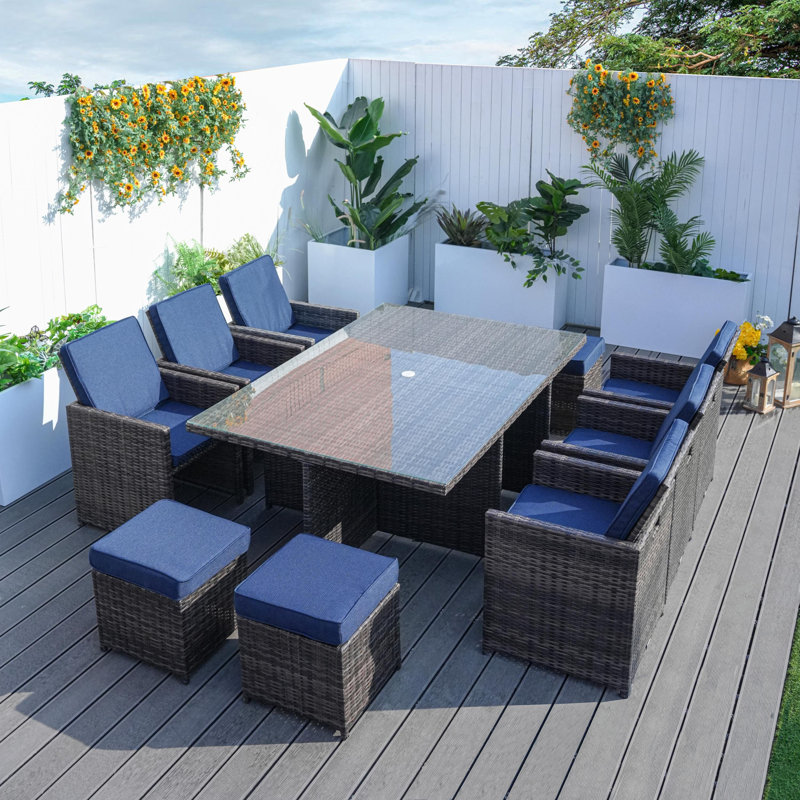 Amher 10 - Person Wicker Patio Dining Set with Rectangular Table , Cushions Included, Brown, Navy Blue