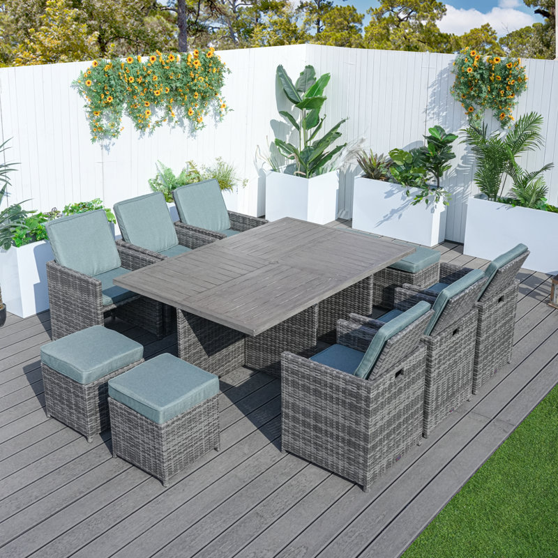 Daoudiate 6 - Person Wicker Patio Dining Set with Rectangular Table , Cushions Included, Gray, Gray