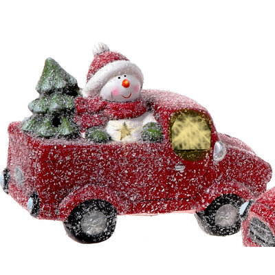 Bonhomme de neige en résine conduisant un camion