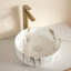 Lavabo de salle de bain circulaire en céramique-126148930
