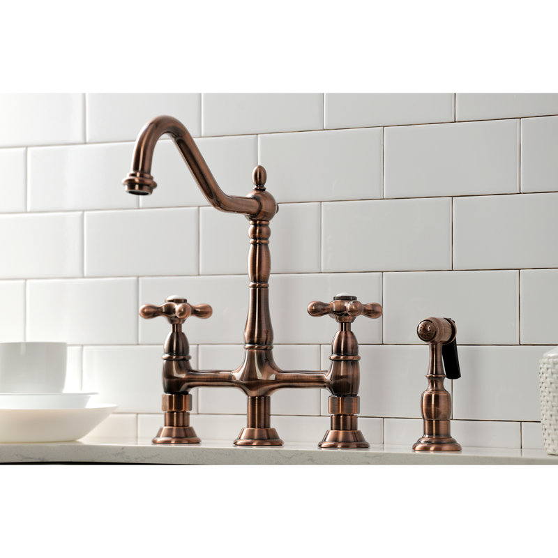 Kingston Brass Heritage Two-Handle 4-Hole Deck Mount Bridge Kitchen Faucet with Brass Side Sprayer, Antique Copper