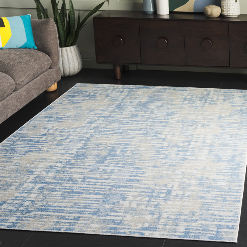 Ivory and Blue Abstract Synthetic Rectangular Area Rug