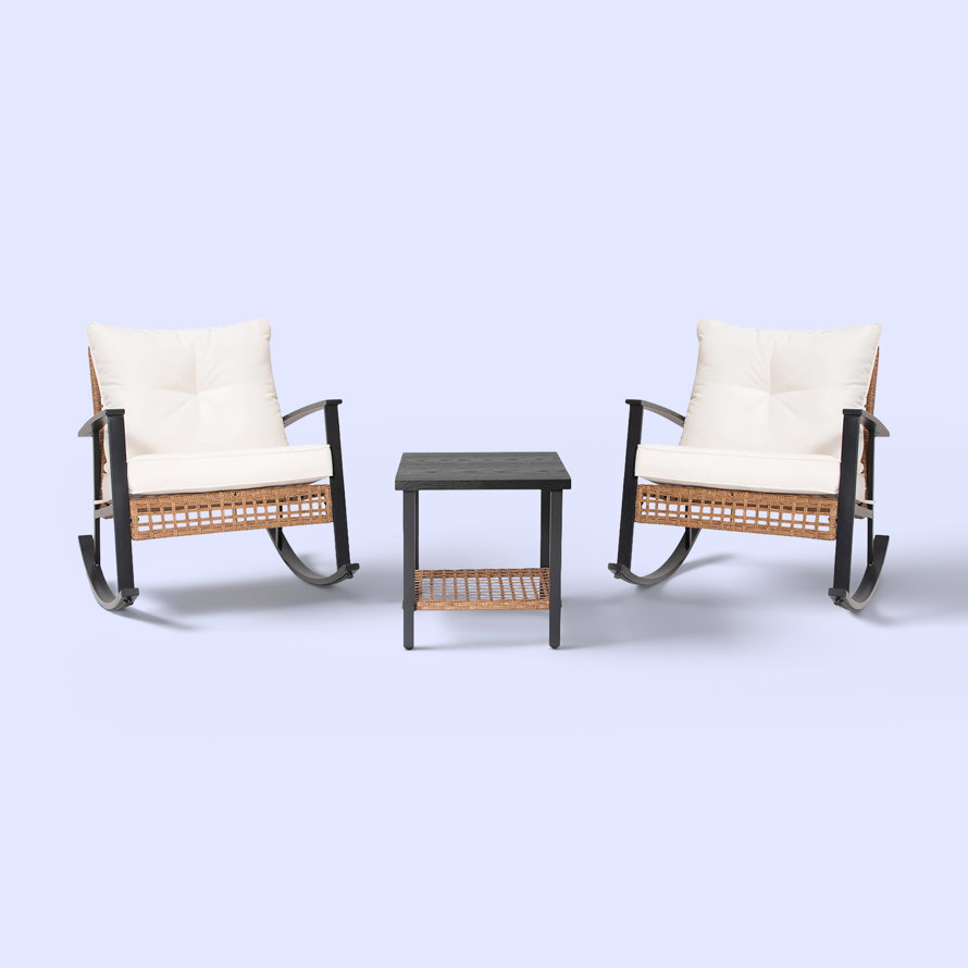 Two rocking chairs and a side table on a light blue background.