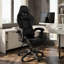 Fauteuil de jeu ergonomique en polyuréthane uni noir avec repose-pieds rétractable