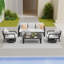 Un canapé trois places + deux chaises pivotantes + une table basse