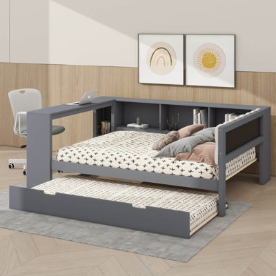 Lit plateforme en bois avec tablettes de rangement intégrées, lit gigogne escamotable, port de chargement USB et tête de lit tapissier
