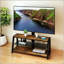 Meuble télé réglable en bois avec verre trempé noir et support pivotant universel, parfait pour les centres de divertissement modernes.