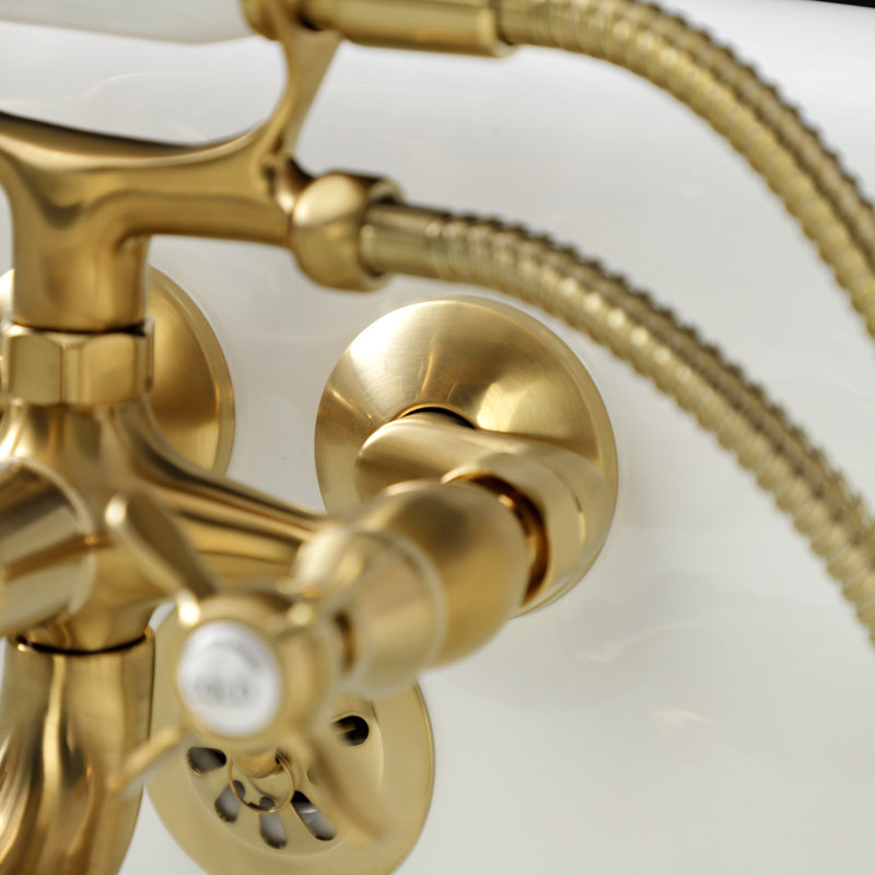 Kingston Brass Essex Three-Handle 2-Hole Tub Wall Mount Clawfoot Tub Faucet with Handshower, Brushed Brass