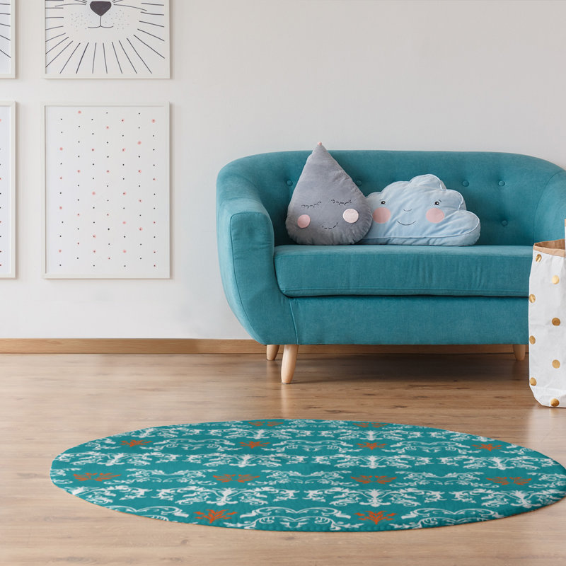 Tapis rond bleu damassé à motif baroque
