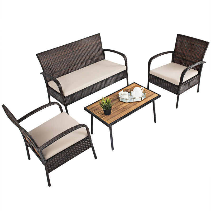 Pranet Rattan 4 - Person Seating Group with Cushions