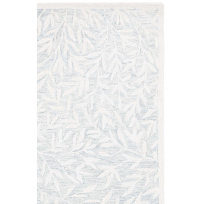 Heraldas Hand Tufted Wool/Cotton Floral Rug in Light Gray/Ivory