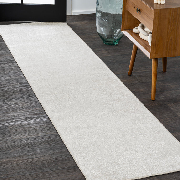 Yaniyah Classic Solid Low-Pile Machine-Washable Cream Rug