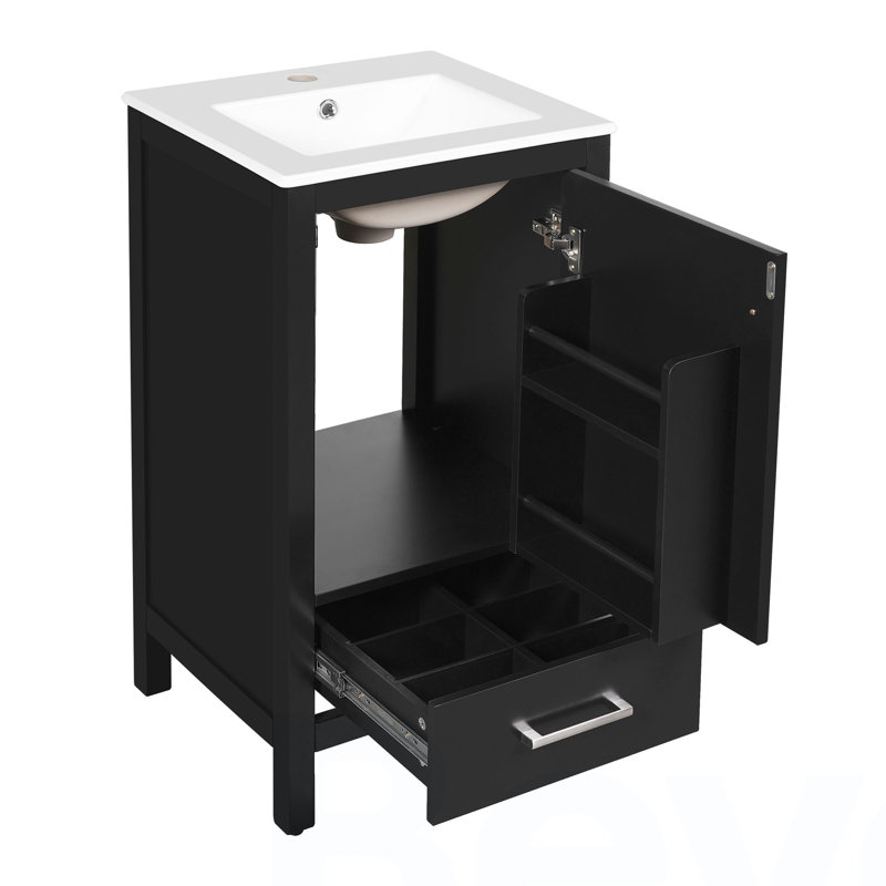 Meuble-lavabo moderne de 18 pouces avec lavabo en céramique, tiroirs à fermeture en douceur et organisateur de porte, tiroir de séparation et patins réglables en plastique - solution de rangement compacte pour les espaces étroits.