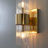 2-light Modern Brass Sconce With Ribbed Glass Shades