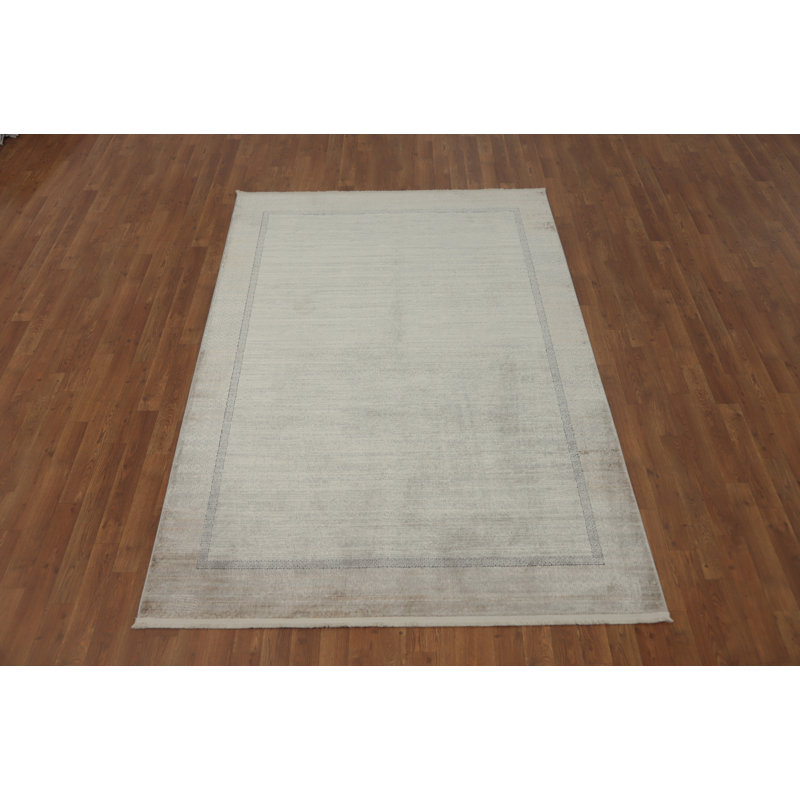 Élégant tapis minimaliste avec des motifs de bordure subtils 5 x 7