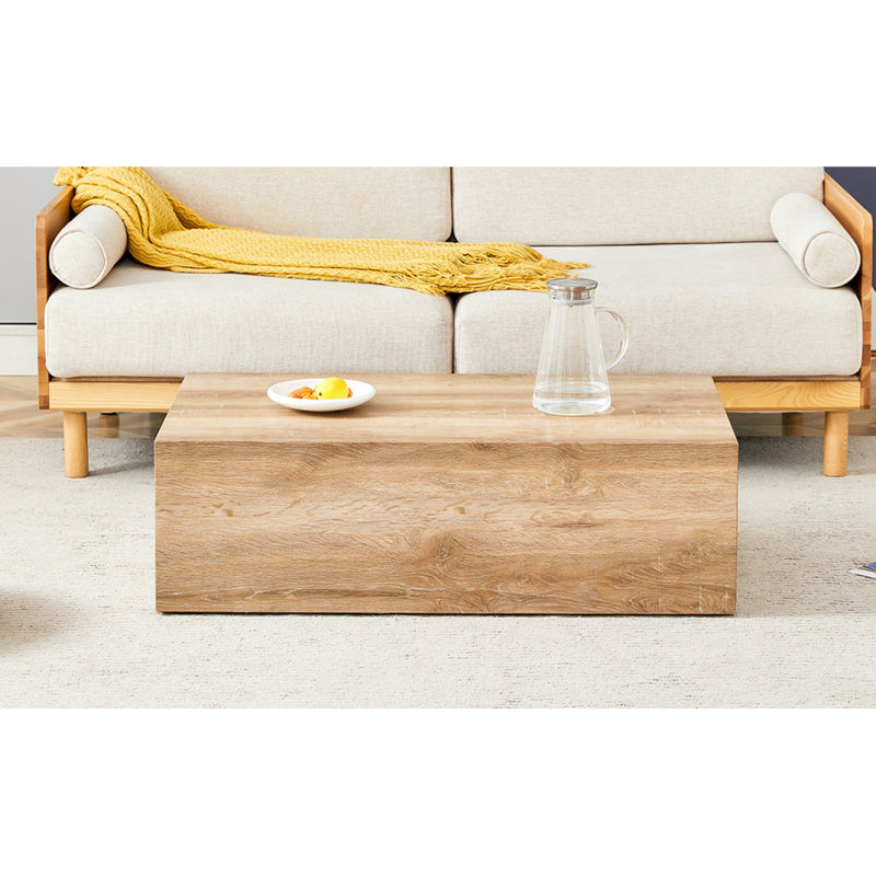 Rehaussez votre espace de vie avec cette table basse moderne en panneau de fibres à densité moyenne qui présente des motifs de texture de couleur bois clair et doux. Il est caractérisé par un design élégant. 39,3 * 23,6 * 12.