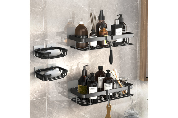 four black adhesive shower caddies filled with shower supplies