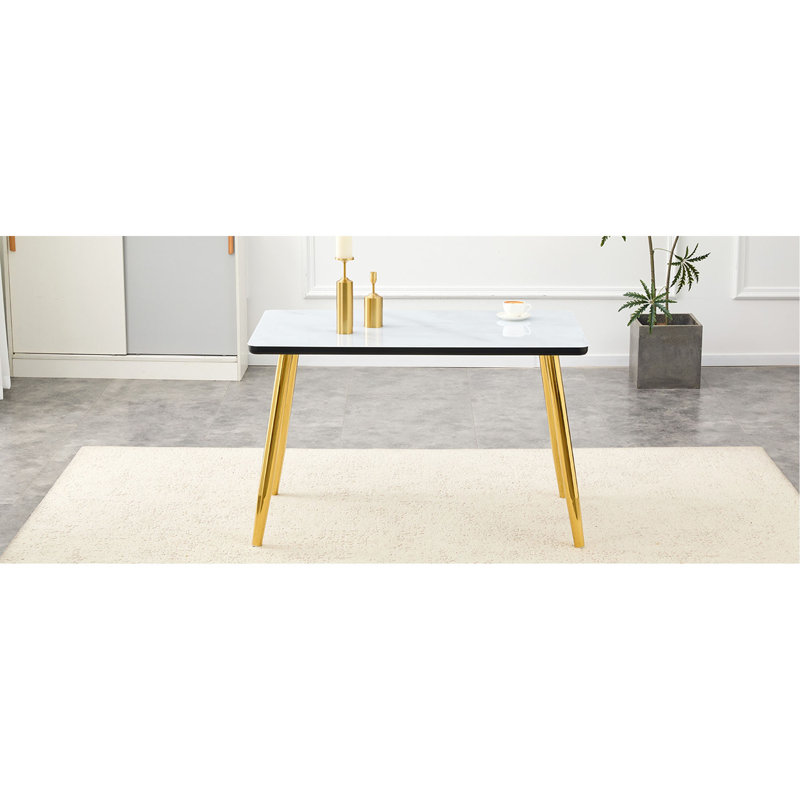 Table de salle à manger rectangulaire moderne et minimaliste, pouvant accueillir de 4 à 6 personnes. Comptoir en verre trempé + panneau de fibres à densité moyenne inférieur, texture imitation marbre, pieds fuselés en métal. Convient aux restaurants minimalistes.