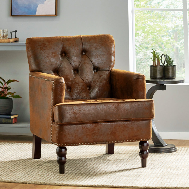 Fauteuil club confortable et capitonné au design élégant pour la détente