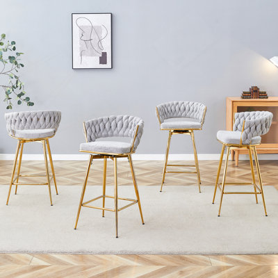 Un ensemble de quatre tabourets de bar rotatifs avec coussins respirants, parfaits pour les îlots de cuisine, les tables de salle à manger et les comptoirs de bar
