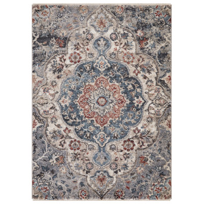 Tapis bleu multicolore à l'esthétique antique
