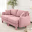 Canapé 2 places rose en tissu bouclé avec pieds cylindriques et en forme de coquillage, offrant une assise confortable et unique conçue pour un confort de détente dans la chambre.