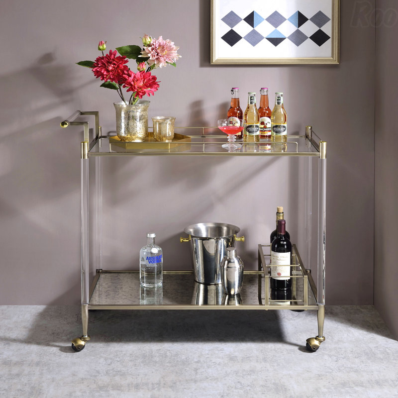 Miroir antique et chariot de service en laiton