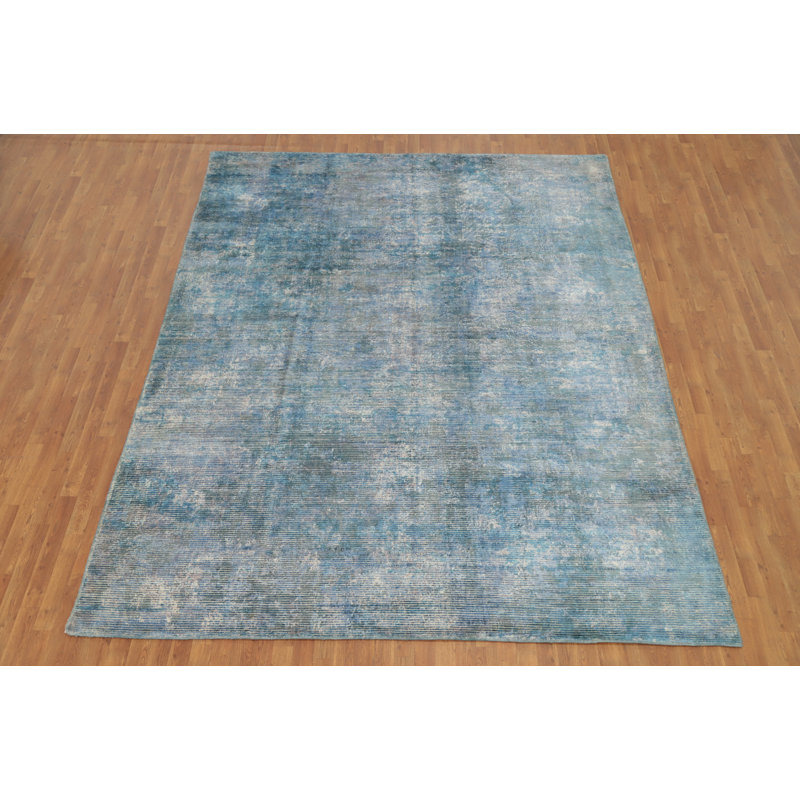 Tapis bleu à aspect délavé abstrait 9 x 11