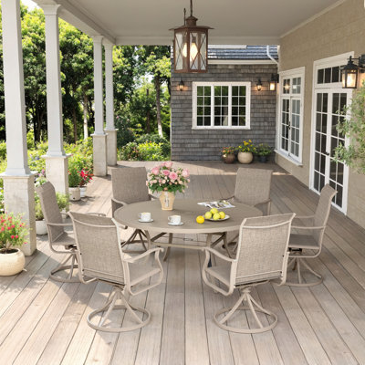 Ensemble de salle à manger de patio pour 6 personnes Baileyville avec table de patio ronde de 53 po et 6 chaises pivotantes en textilène