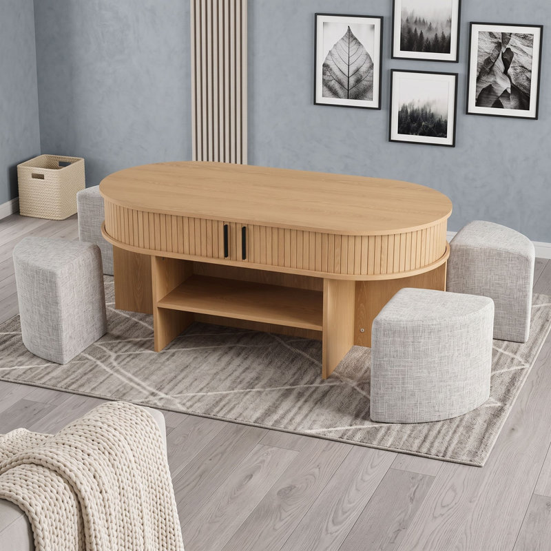 Ensemble de tables basses ovales avec tabourets rembourrés, table centrale gigogne avec tablettes ouvertes et rangement caché