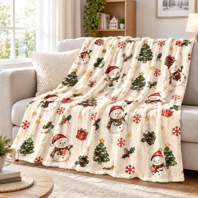 Couverture polaire douce et légère à motif sapin et bonhomme de neige pour Noël, idéale pour canapé, chambre ou salon. Décoration intérieure.