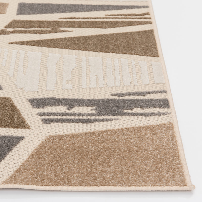 Ivory and Taupe Geometric 5' x 7' Synthetic Area Rug