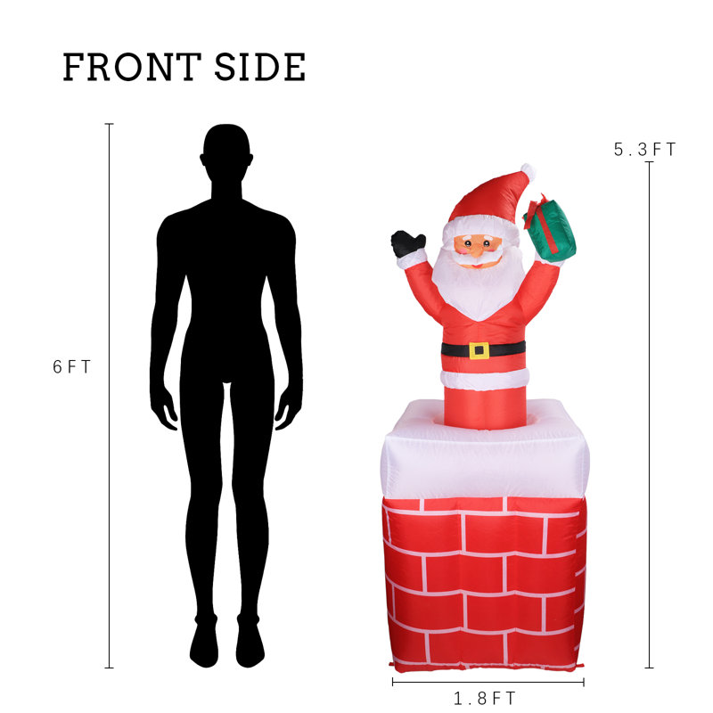 Décoration de Noël père Noël dans une cheminée gonflable