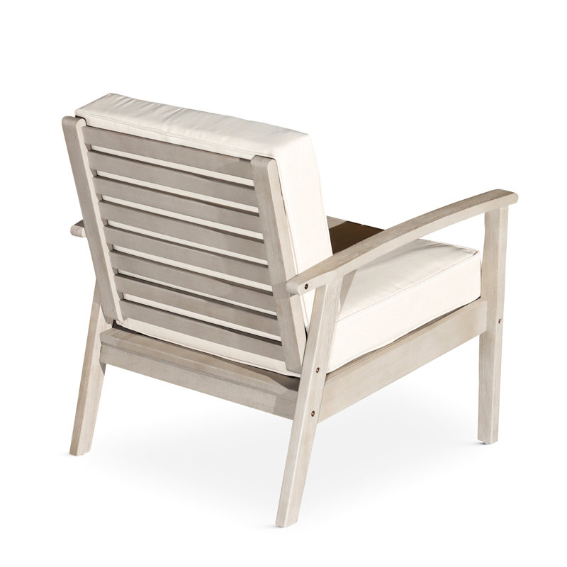 Chaise en eucalyptus gris argenté avec coussins foncés, assise profonde pour l'extérieur et salon confortable