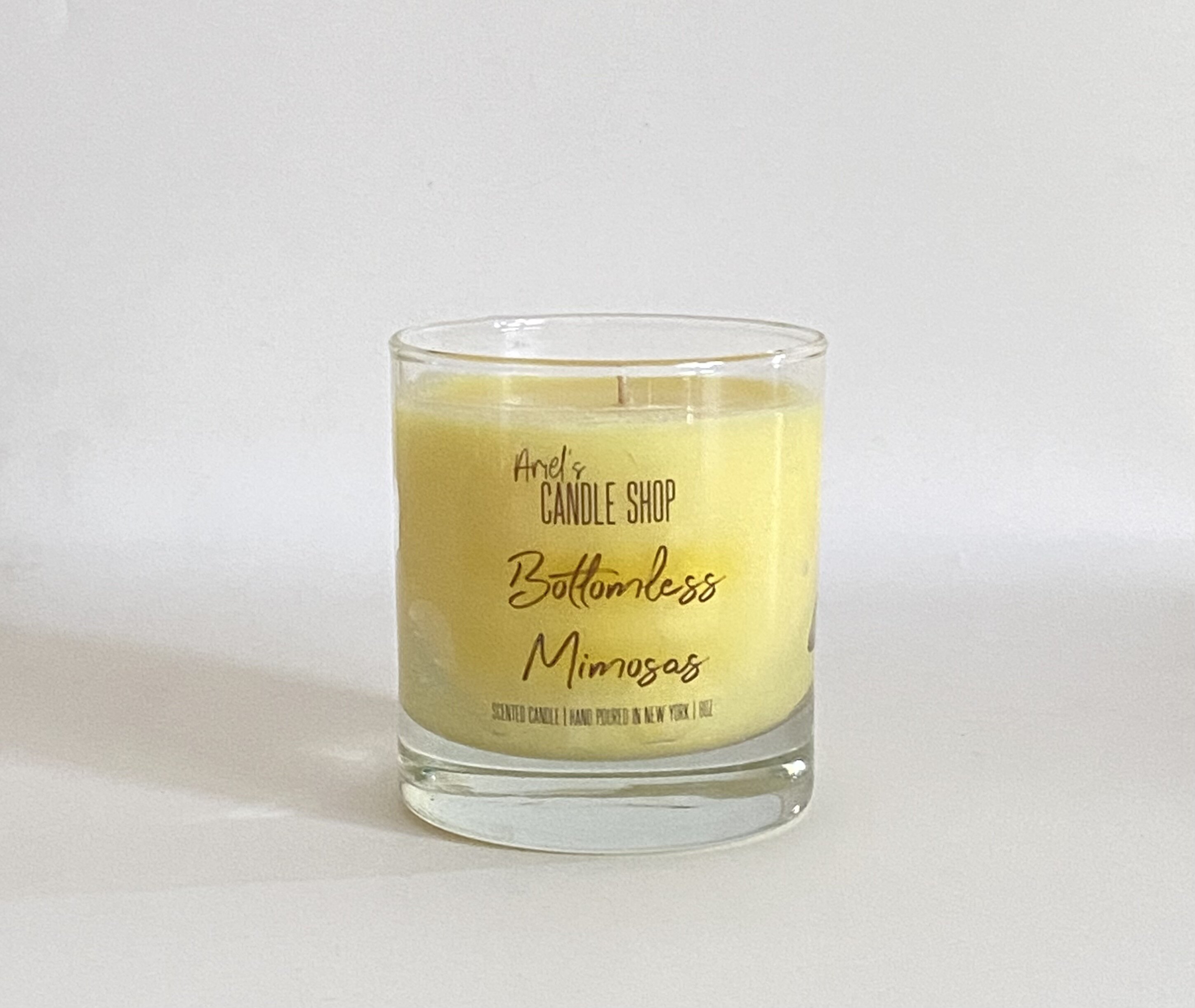 https://assets.wfcdn.com/im/05763601/compr-r85/1844/184473200/cocktail-collection-bottomless-mimosas-scented-jar-candle.jpg