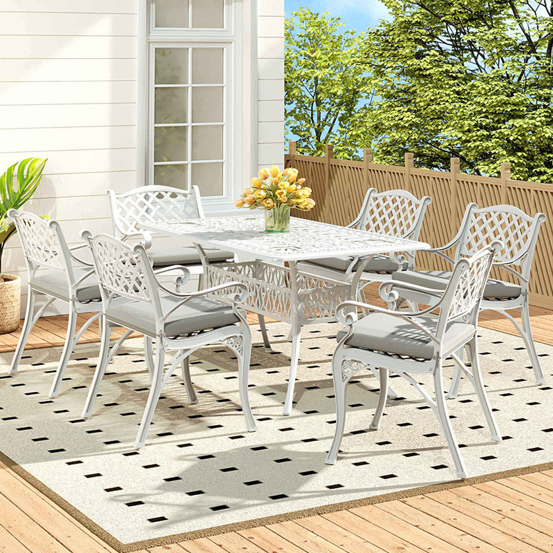 Claudi 6 - Person Patio Dining Set Umbrella Hole Included Rectangular Table with Cushions Included, White