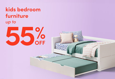 Kids bedroom furniture up to 55% off featuring a white daybed with a pull-out trundle.