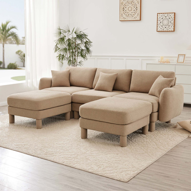 Canapé 3 places Boucle avec accoudoirs distinctifs en forme de coquillage, 2 repose-pieds amovibles et pieds cylindriques - enveloppé de tissu