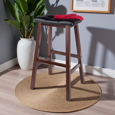 Middleburg Black and Walnut Cushion Saddle Seat Bar Stool by August Grove