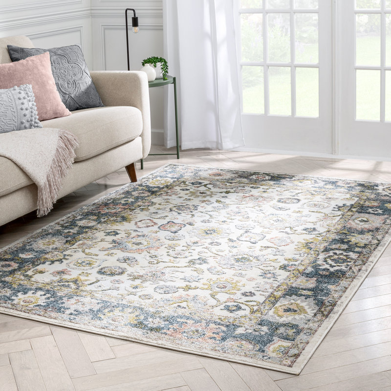 Ivory and Blue Synthetic Oriental Area Rug 5'3" x 7'3"