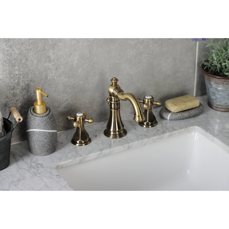 Kingston Brass Metropolitan Two-Handle 3-Hole Deck Mount Widespread Bathroom Faucet with Pop-Up Drain, Antique Brass
