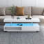 Table basse moderne blanche avec éclairage DEL et rangement. 16 couleurs disponibles, luminosité variable. Tiroirs et étagères spacieux. Montage facile. Directives incluses. Table basse contemporaine pour salon : blanche.