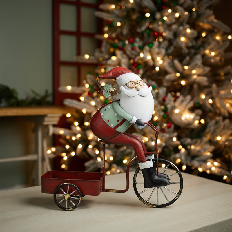 Père Noël fantaisiste faisant du vélo