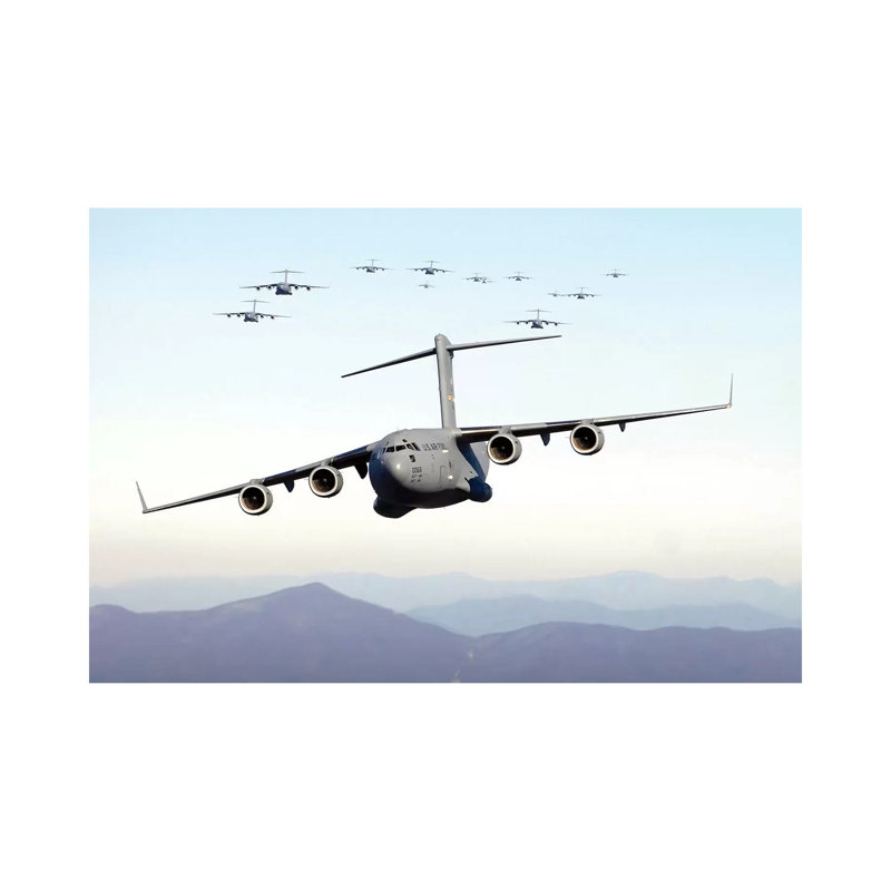 A Formation Of 17 C-17 Globemaster Iiis Fly Over The Ridge Mountains by Stocktrek Images - Wrapped Canvas Print