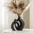 Nestled In A Hollow Ceramic Vase-64810638