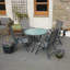 Eleni 4 - Person Patio Dining Set Umbrella Hole Included Round Table