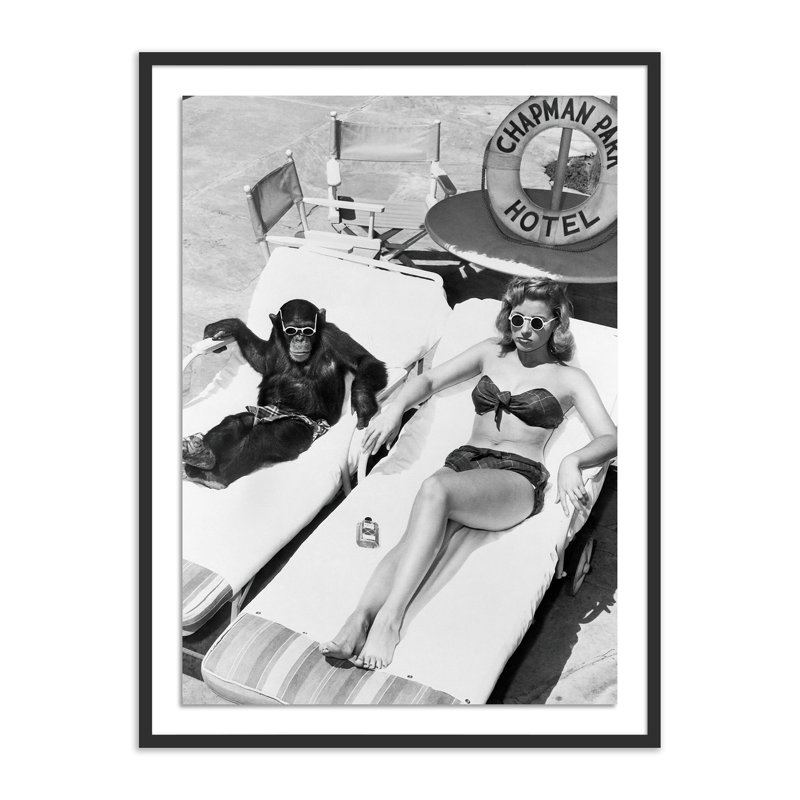 Woman Sunbathing With Chimpanzee Print by Getty Images, Black Maple Framed, 40" H x 30" W