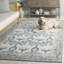 Tapis en laine, coton et viscose touffeté à la main ivoire et bleu Louella-1144609786