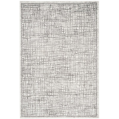 Tapis géométrique ivoire / argent Bethlyn