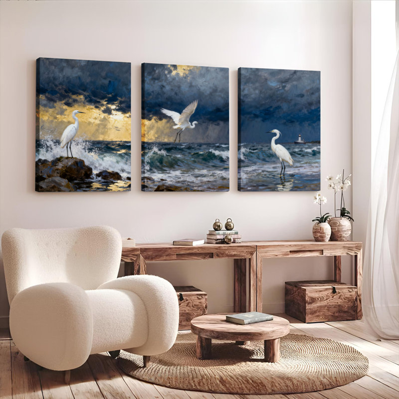 Ensemble de 3 tableaux sur toile tendue représentant un héron blanc au coucher du soleil sur l'océan, H 24 po x l 48 po